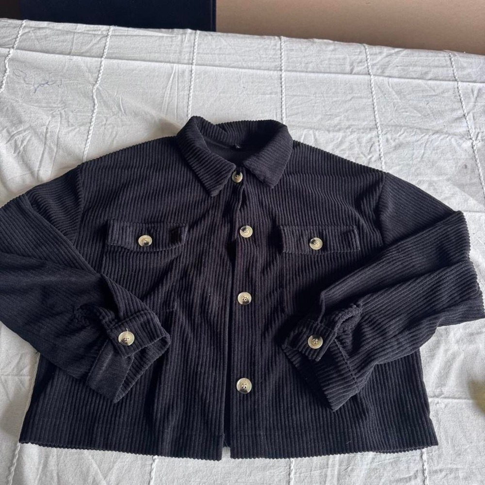Black ribbed knit polyester & spandex jacket in a L